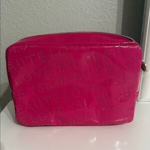 Yves Saint Laurent Glossy Hot Pink Perforated Logo Cosmetic Pouch
